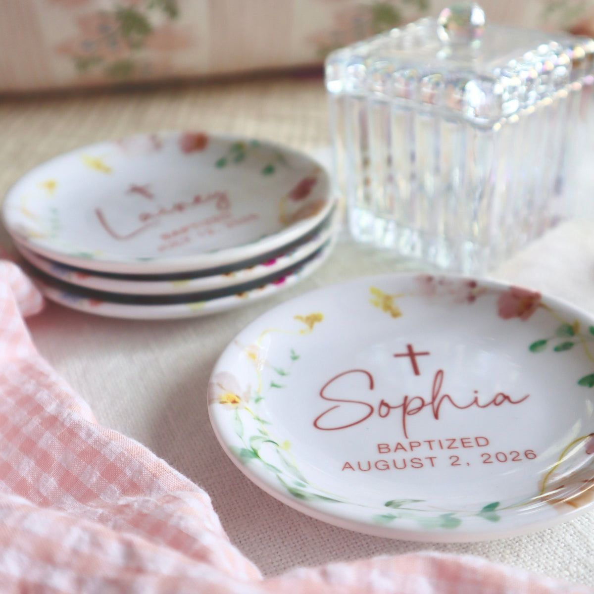 Personalized ceramic baptism jewelry dish. Pink floral edge, custom text, pink cross in center