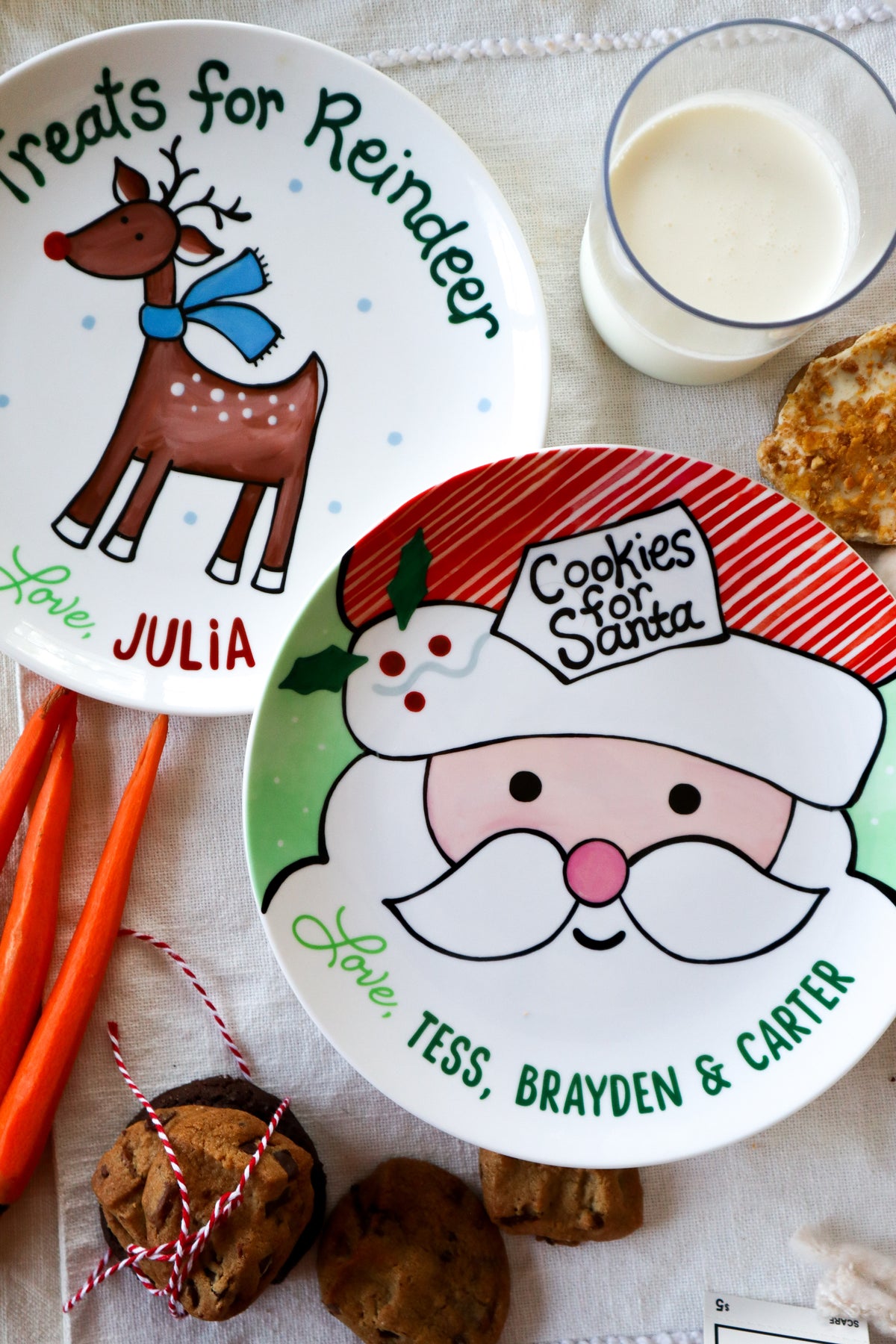 Classic cookies for Santa ceramic plate and matching reindeer plate. With carrots, cokies, milk. Christmas Eve place setting for Santa