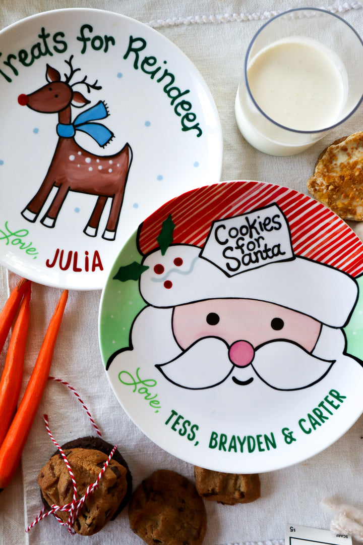 Classic cookies for Santa ceramic plate and matching reindeer plate. With carrots, cokies, milk. Christmas Eve place setting for Santa